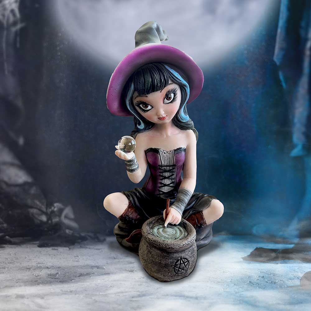 A figurine of a young witch stirs a cauldron while holding a crystal ball, set against a mystical, moonlit background. The cauldron features a star symbol.