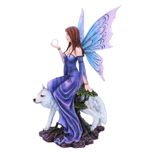A fairy with blue and lavender wings, seated on a white wolf, holds a clear orb in her hand. They are on a rocky outcrop with a small tree.
