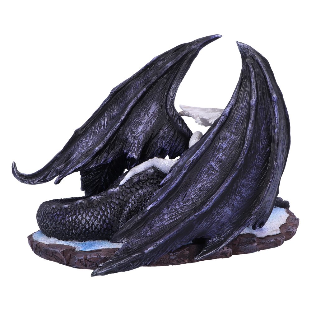 Black dragon figure resting with its wings folded around its body, on a snow-dusted rock platform. The environment suggests a cold, wintry setting.