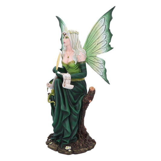 Fairy with green wings sits on a tree stump, quill in hand and wearing a flower crown, writing on a scroll that reads, "Nut..."