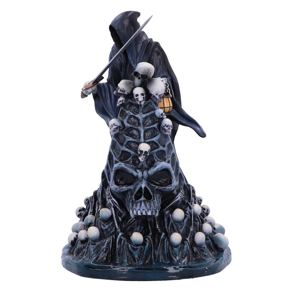 The statue depicts a hooded grim reaper holding a sword while standing atop a mound of skulls and draped fabric, also carrying a lantern. The background is plain white.
