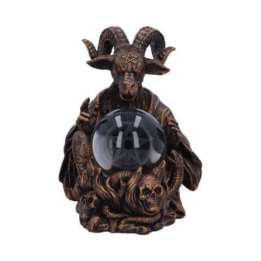 A Baphomet statue with red eyes clutches a pentagram-etched crystal ball, seated on skulls and snakes amidst fire-like textures.