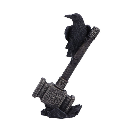 A black raven statue sits perched on the handle of a grey Mjolnir statue. The hammer rests on a jagged rock base against a white background.
