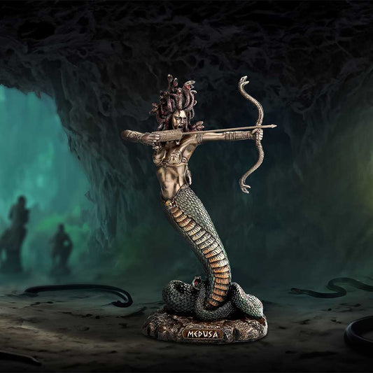 A Medusa statue, aiming a bow and arrow, is positioned within a dark, cavernous setting. The base of the statue is inscribed "MEDUSA".