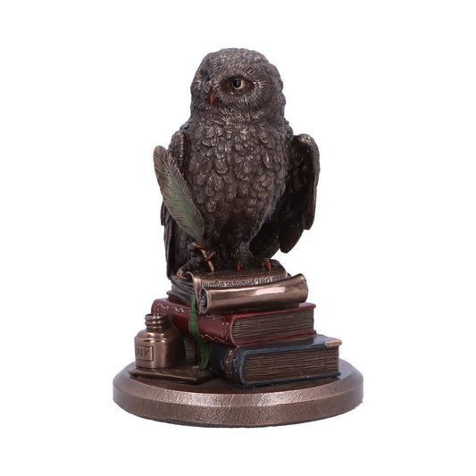 A bronze owl figurine sits perched atop a stack of books and a quill, an inkwell nearby, against a white background. The scroll reads "QUISQUIS SAPIENTIAS TAO."