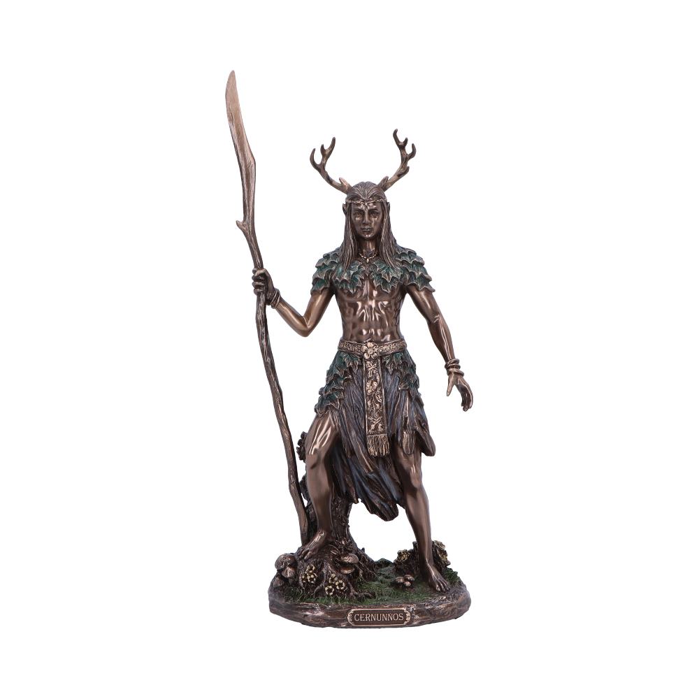 A bronze statue of Cernunnos, a horned Celtic deity, stands holding a staff; he is depicted in a forest setting on a small base. CERNUNNOS is inscribed on the base.