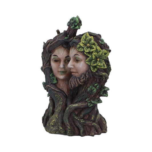 Two intricately carved stone faces, a male and female, blend into a tree-like structure with vines and green leaves, symbolizing nature's unity and harmony.
