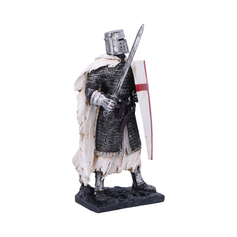 Medieval knight figurine stands on a rocky base, holding a raised sword and white shield with a red cross, wearing chainmail and a tattered white cloak with helmet visor down.