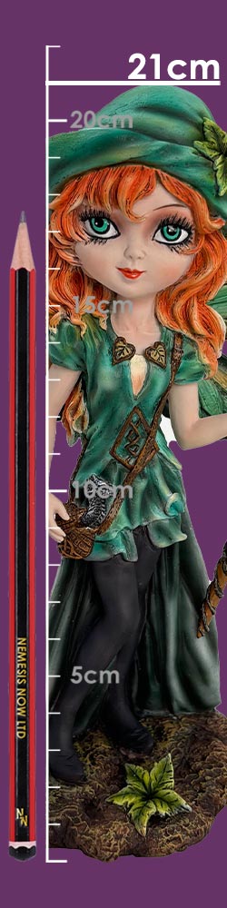 Red-haired fairy-like figurine stands with one hand on hip wearing a green hat and dress on a mossy base beside a vertical centimeter scale and a pencil; text: 21cm, 20cm, 5cm, 10cm, 5cm, NEMESIS NOW LTD