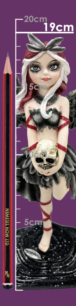 Gothic fairy figurine stands on a textured base holding a skull at waist level, wearing black feathered costume, red ribbons and leaf headpiece, posed against a purple background with ruler and pencil; text: 20cm 19cm 5cm 10cm 5cm NEMESIS NOW LTD NN