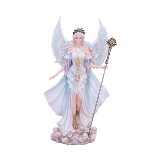 Angelic figurine stands on a rocky base with wings outstretched, wearing a layered pastel gown and crown, holding an ornate staff, hair cascading over her shoulders.