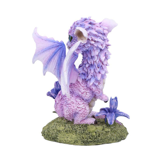 Purple baby dragon figurine sitting with partially spread wings and turned head on a grassy base with a purple flower, white background; base marked "©GA".
