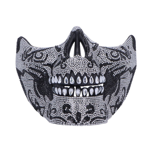 Bedazzled skull-shaped face mask covered in silver and black rhinestones with teardrop crystal teeth, displayed front-facing against a clean white background.