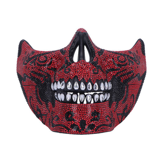 Bejeweled half-skull mask sparkles with red and black rhinestones, presenting faceted teardrop crystal teeth and a black nasal opening against a plain white background.