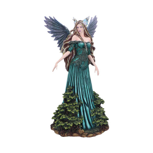 Winged female figurine stands with outstretched arms wearing flowing teal gown adorned with leaf motifs, long wavy hair and purple gray wings, rooted on mossy base against white background.