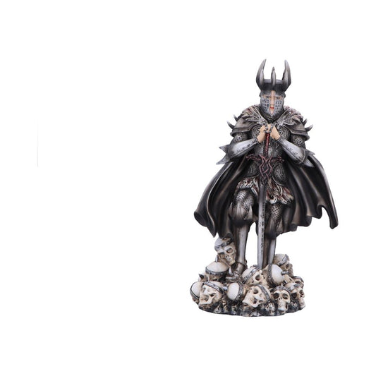 Armored horned knight statue kneels with hands clasped on sword, standing atop a pile of skulls, wearing ornate plate armor, fur-trimmed cloak and visored helmet against a white background.