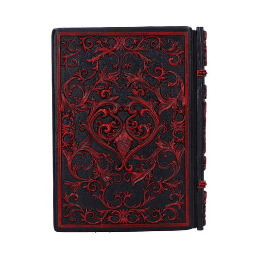 Ornate black leather-bound book embossed with red floral scrollwork, closed and standing upright against a plain white background.