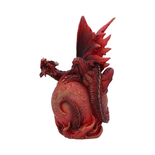 Red dragon figurine coils and snarls atop a textured orb with raised scales and flame like base against a plain white background