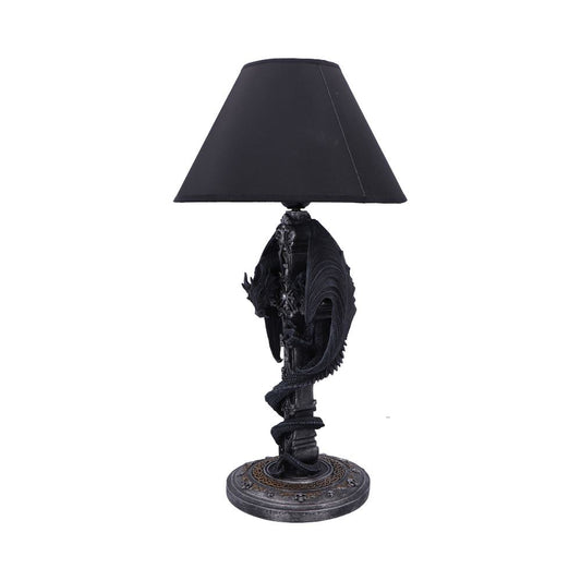 Decorative black table lamp featuring a coiled dragon base supporting a tapered black fabric shade, standing on an ornate round pedestal against a plain white background.