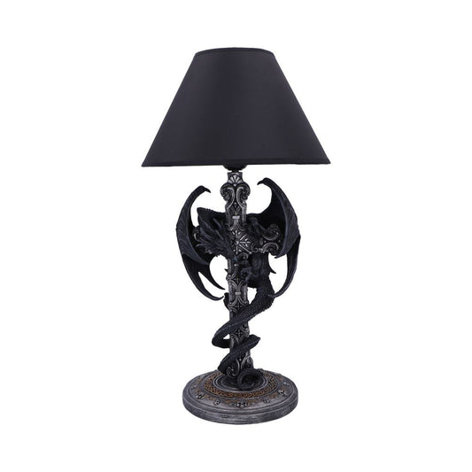 Table lamp with a black conical shade, a sculpted dragon coiled around an ornate stone-like column and round decorative base against a plain white background.