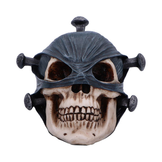 A weathered skull wearing a torn dark cloth blindfold and pierced horizontally by four large iron nails, positioned against a plain white background.