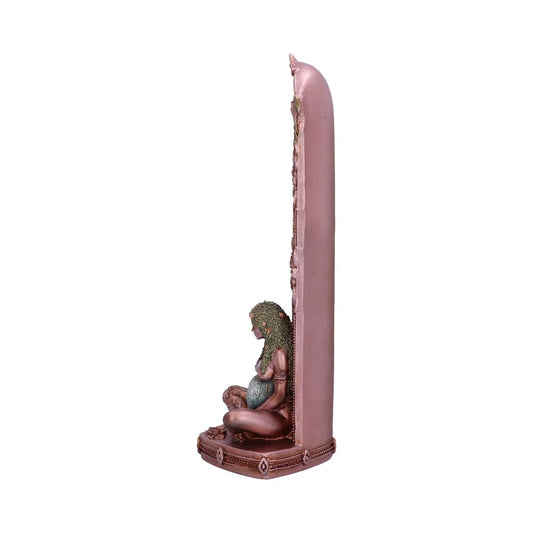 A bronze figurine of a seated woman holding a globe rests against a tall, slender, decorative pillar; the background is white.