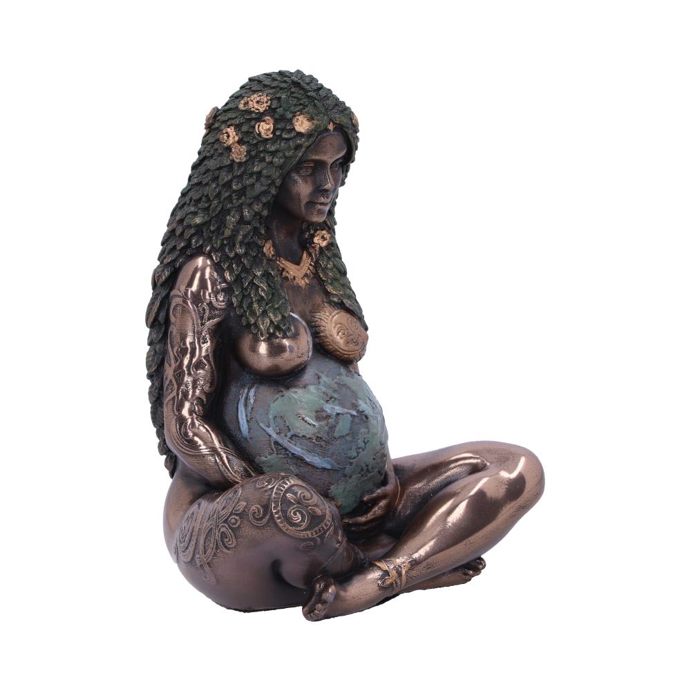 A bronze-colored statue of a seated pregnant woman with elaborate hair and body tattoos, holding her round belly, adorned with a world map, sits in a contemplative pose.
