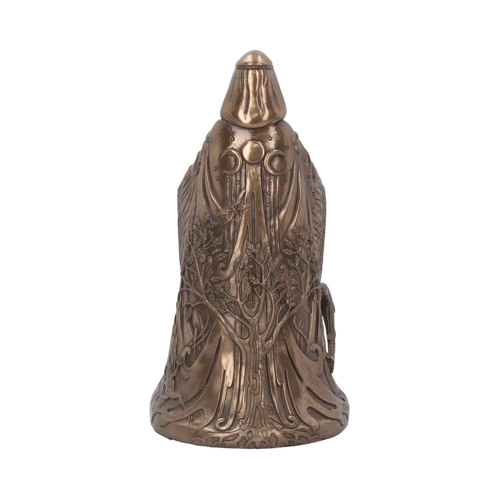 Bronze-colored figurine stands with an ornate design featuring tree and vine motifs. Hooded figure appears in a mystical, decorative style with crescent moon symbols, set against a plain white background.