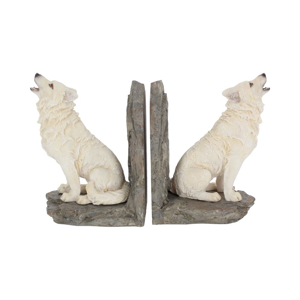 White wolf figurines, howling, sit back-to-back on a textured stone base, forming decorative bookends.