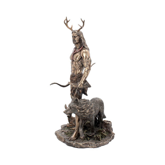A bronze-colored statue depicts a muscular, antlered man holding a bow, accompanied by a wolf. They stand on a textured base resembling rock and foliage.