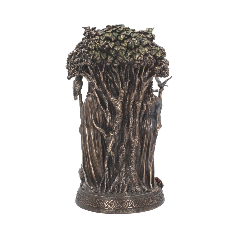 Sculpture of intricately detailed tree with thick foliage, featuring two robed figures merged with its trunk, on a circular base with engraved patterns, isolated on a white background.