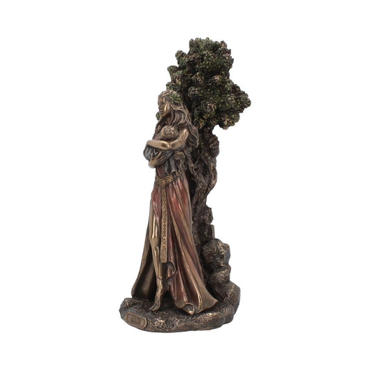 A bronze-toned statue depicts a woman in a flowing dress holding a baby, standing beside a textured tree. The base reads "Danu."