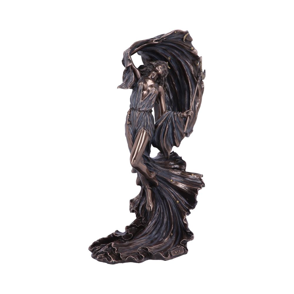 Bronze-colored statue depicting a gracefully draped figure dancing with flowing fabric, capturing a sense of movement. The base displays the inscriptions "NYF" and "MIY" in an ornate, swirling style.