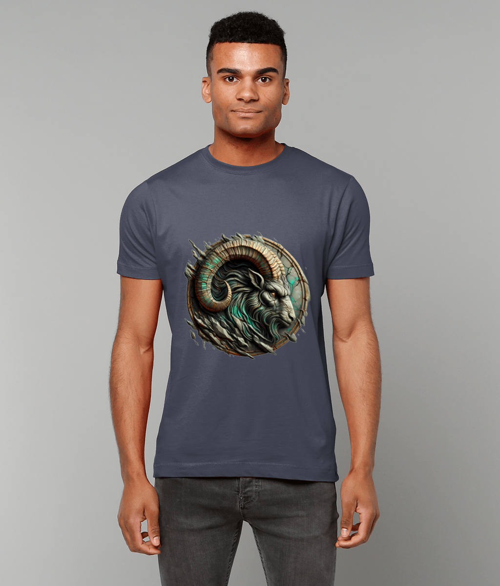 Ram's horned head graphic faces left, rendered with teal highlights and a cracked circular frame on a fitted gray T-shirt worn by a standing man against a plain light-gray backdrop.