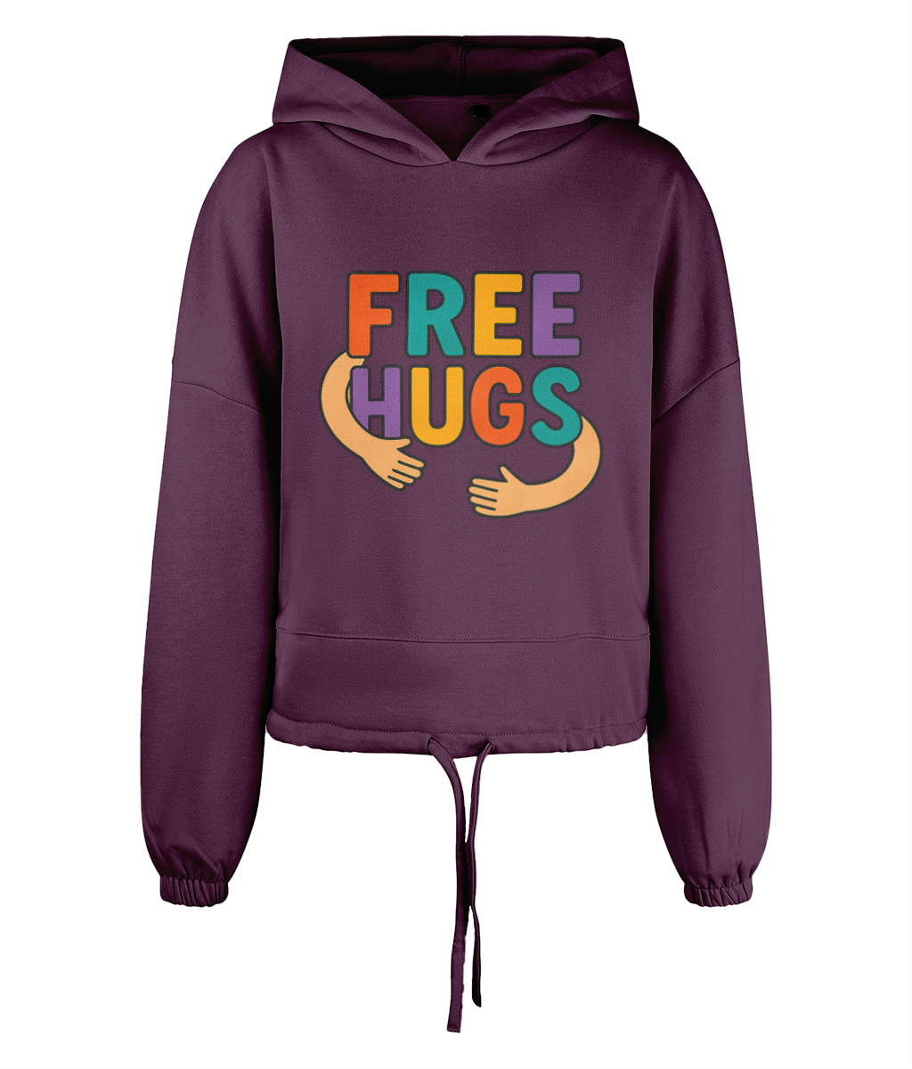 A plum colored hooded sweatshirt displays the text FREE HUGS in bold multicolored letters with stylized cartoon arms reaching inward, shown centered against a black background.