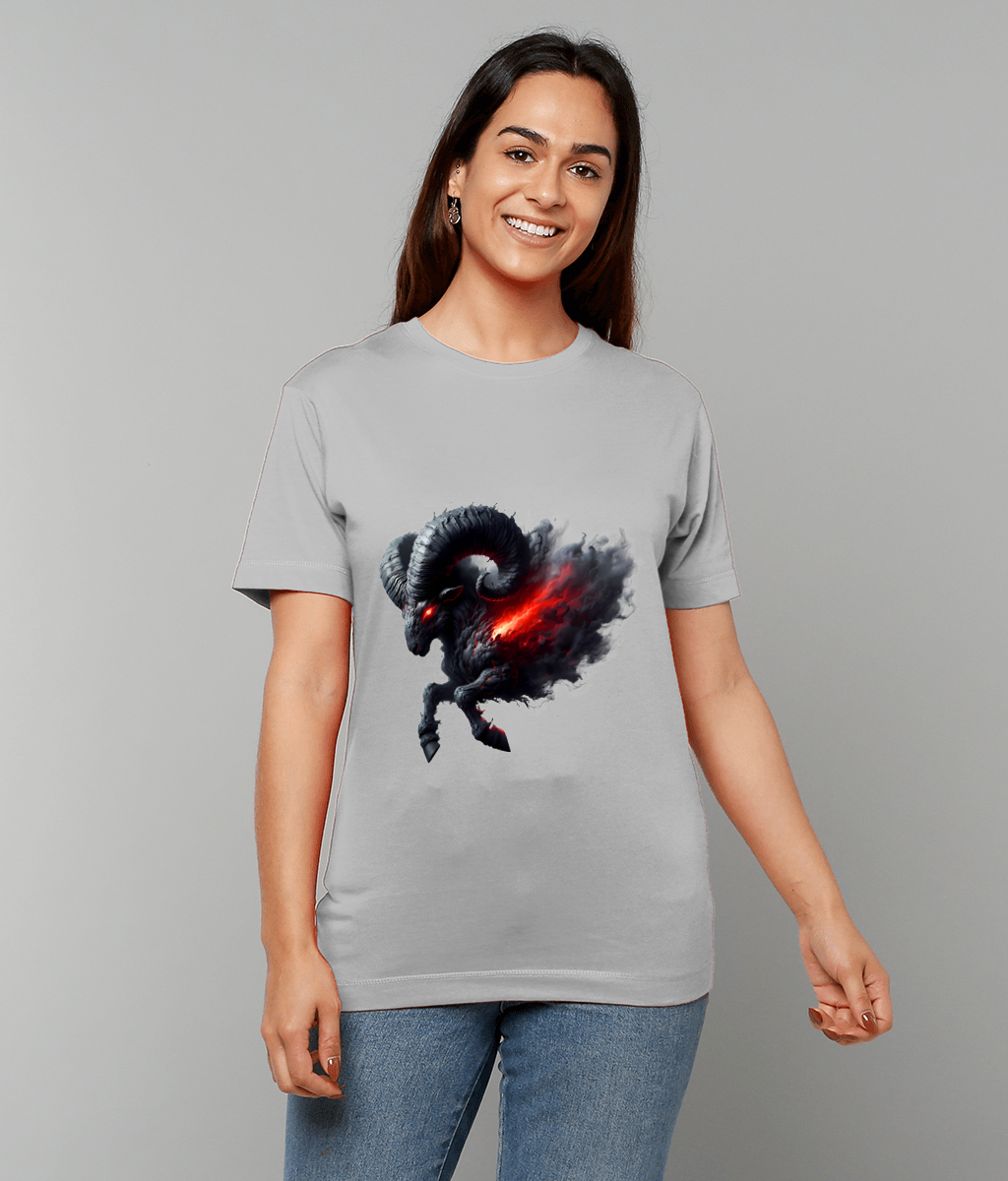Dark horned ram charging with smoky black fur and glowing red core printed on a light gray t-shirt worn by a smiling person in jeans against a plain gray backdrop.