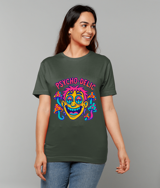 T-shirt displays a neon cartoon grinning face framed by colorful mushrooms and the text "PSYCHO-DELIC" while worn by a smiling person standing against a plain gray background.