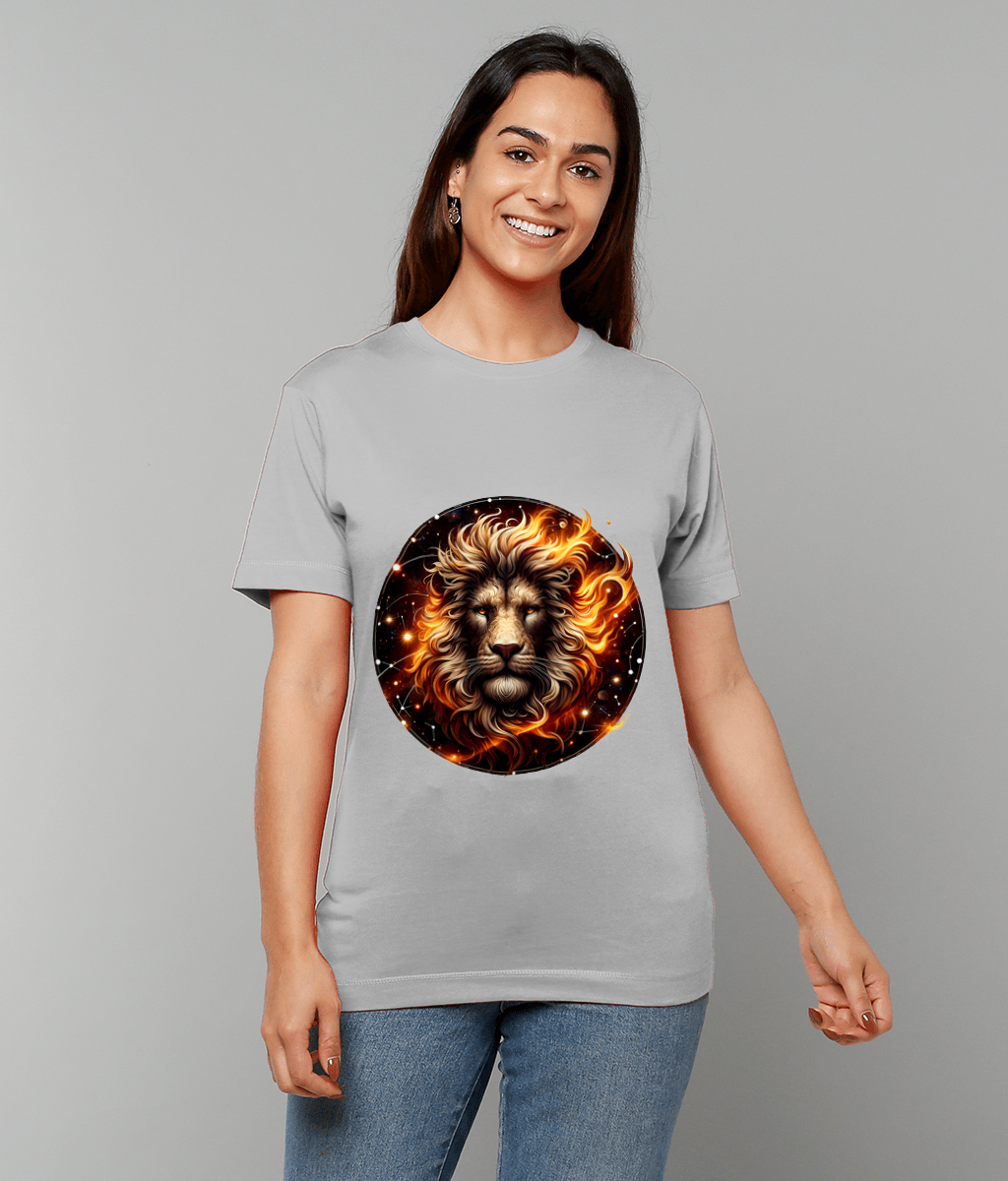 Smiling person wearing a light gray T-shirt displays a round lion face graphic with fiery mane and glowing sparks across the chest against a plain neutral background.