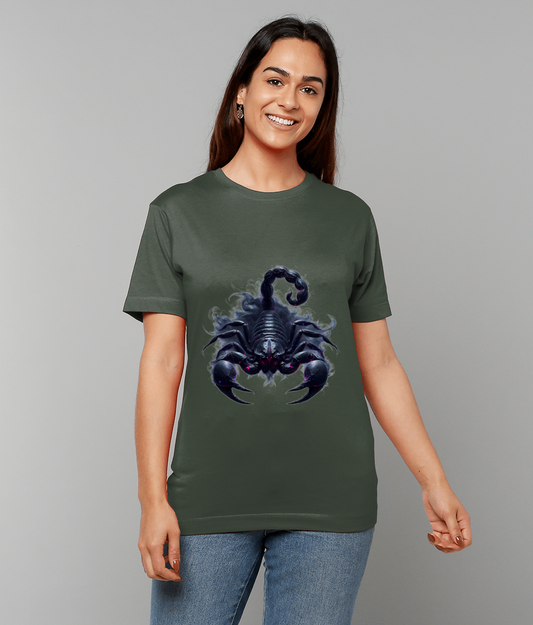 Person wearing olive-green t-shirt displaying a dark scorpion graphic with raised tail and open claws, smiling and standing against a plain light gray studio background.