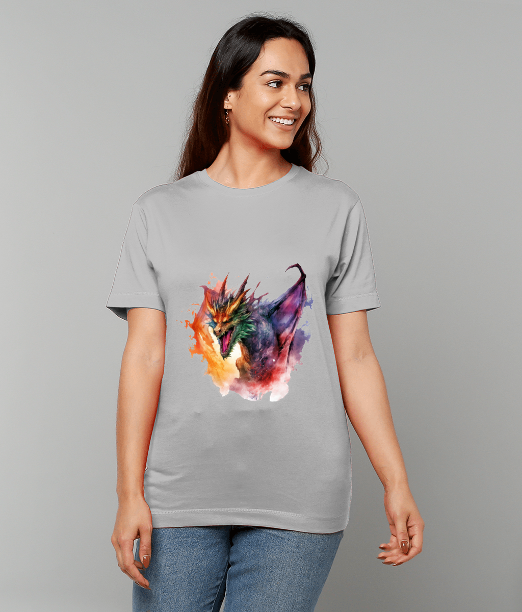 Woman wearing light gray T-shirt displaying a colorful watercolor dragon head, smiling and looking to her left, standing against a plain neutral gray background.