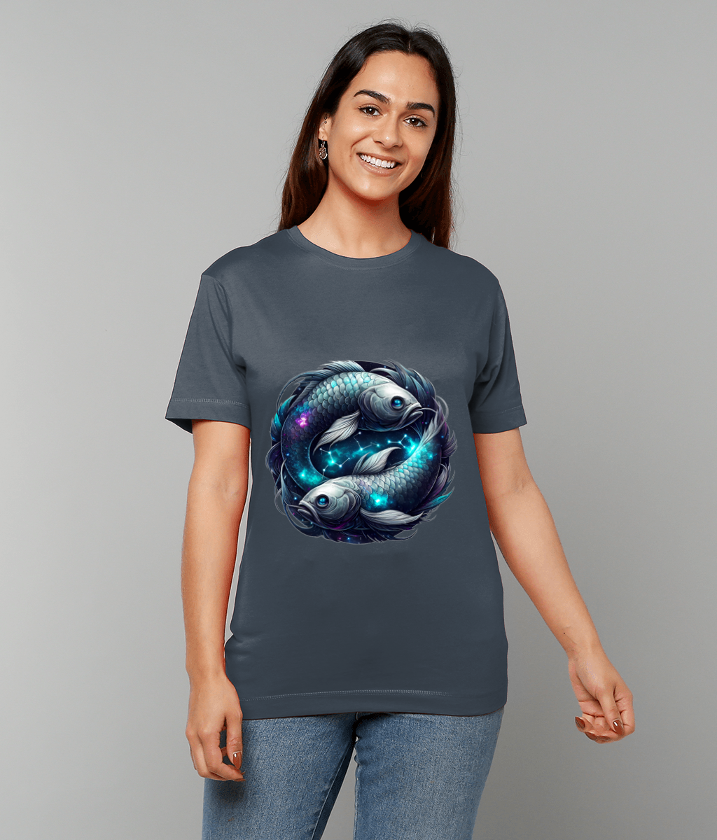 T-shirt displaying two koi-like fish circling each other with glowing nebula-like blue and purple accents, worn by a smiling woman standing against a plain light gray background.