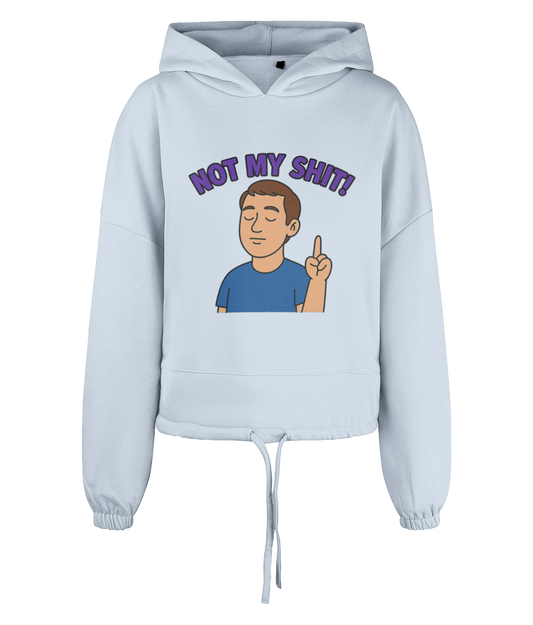 Light blue cropped hoodie shows a cartoon man with closed eyes raising one finger, with bold purple text above reading NOT MY SHIT!, photographed against a plain black background.