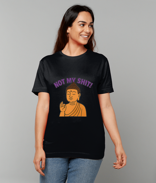 Woman wearing black T-shirt displaying orange Buddha illustration and text 'NOT MY SHIT!' smiling and looking to the right against a plain gray background.
