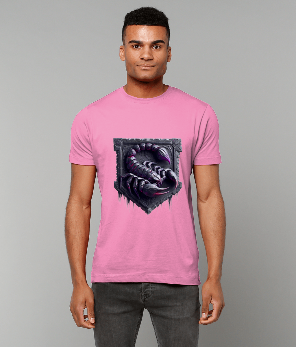 Male model stands facing the camera wearing a pink T-shirt printed with a dark metallic scorpion emblem, hands relaxed at his sides against a neutral light gray studio background.