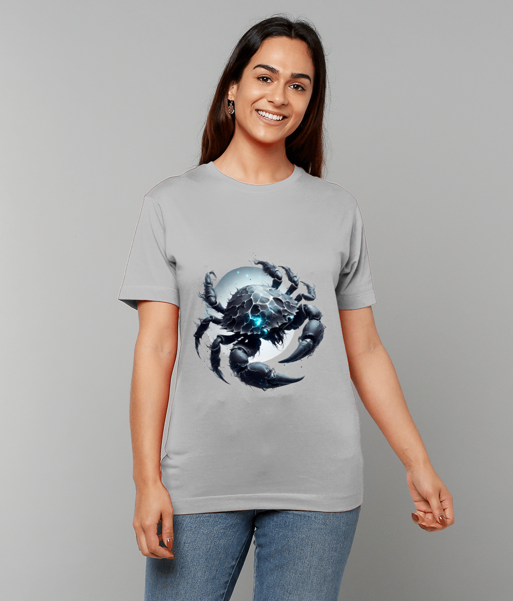 A stylized armored crab graphic wraps its clawed legs around a glowing blue orb printed on a gray T-shirt worn by a smiling woman standing against a light gray background.