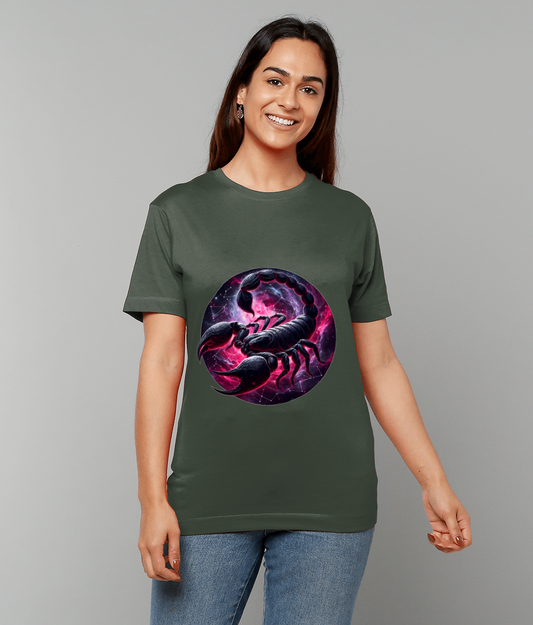 Olive-green T-shirt shows a large circular purple-pink scorpion graphic; a smiling person models it with relaxed posture against a plain gray background.