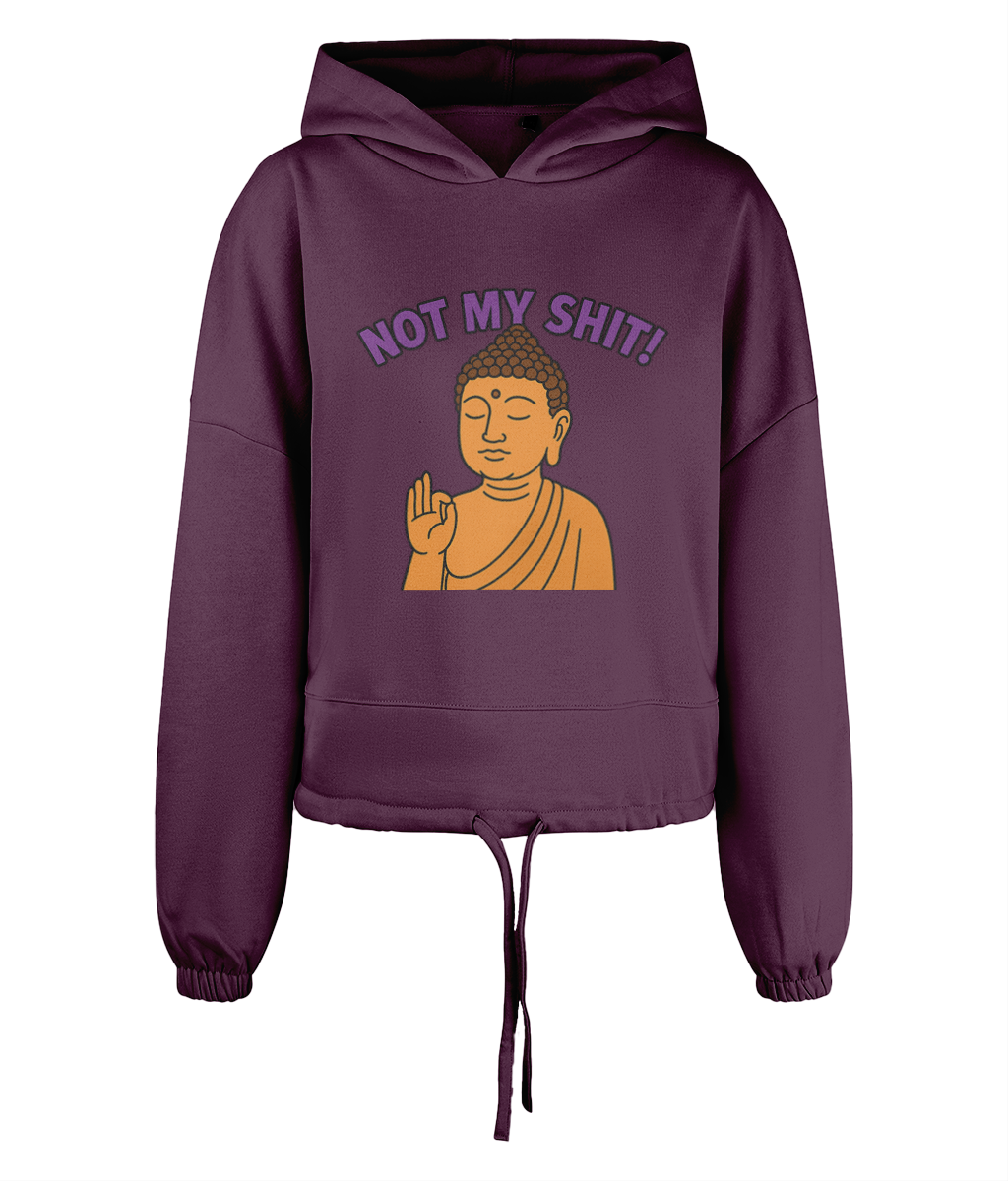 Purple cropped hoodie shows an orange Buddha holding a raised hand in blessing while bold purple text above reads NOT MY SHIT! on a black backdrop.