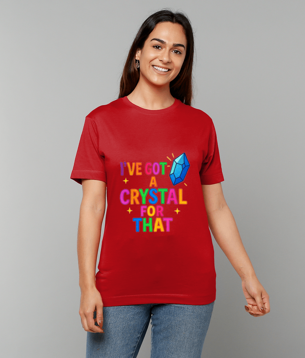 Red T-shirt displaying text "I'VE GOT A CRYSTAL FOR THAT" with blue crystal graphic; person smiles and stands relaxed against a plain light gray background.