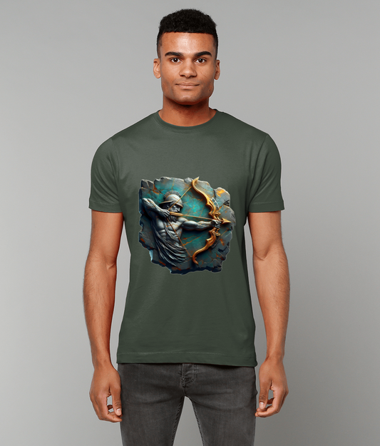 Olive-green T-shirt displays a sculpted helmeted archer pulling a golden bow against cracked teal stone, worn by a standing man against a plain light-gray studio backdrop.