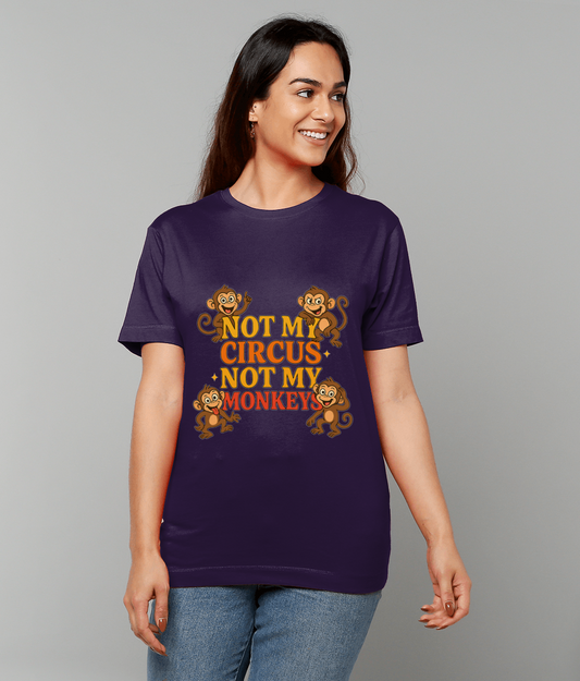 Purple T-shirt reads "NOT MY CIRCUS NOT MY MONKEYS" with four cartoon monkeys, worn by a smiling person standing against a plain light gray background.